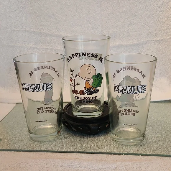 Three 2018 Holiday Peanuts drinking glasses